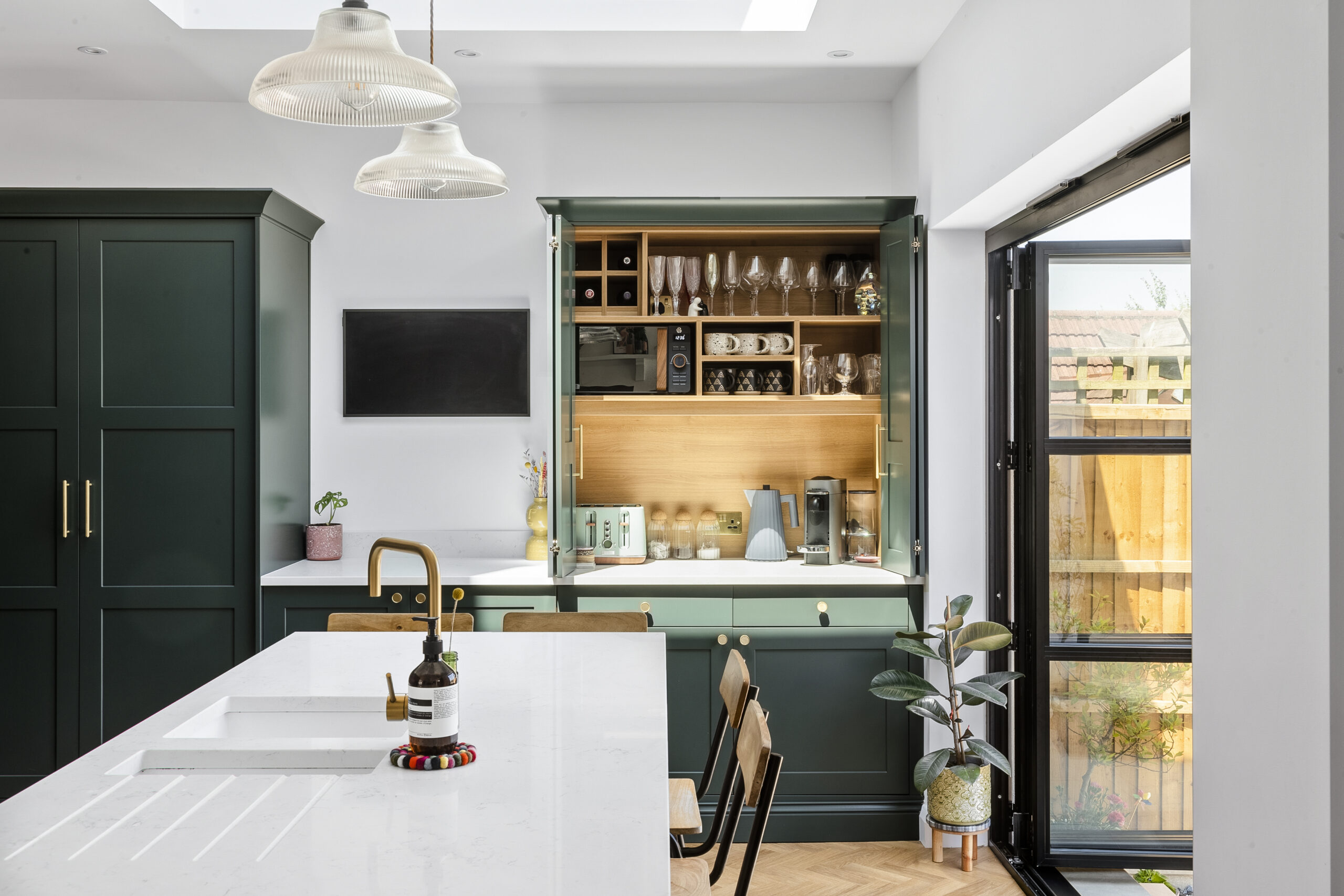 Green and pink extended kitchen